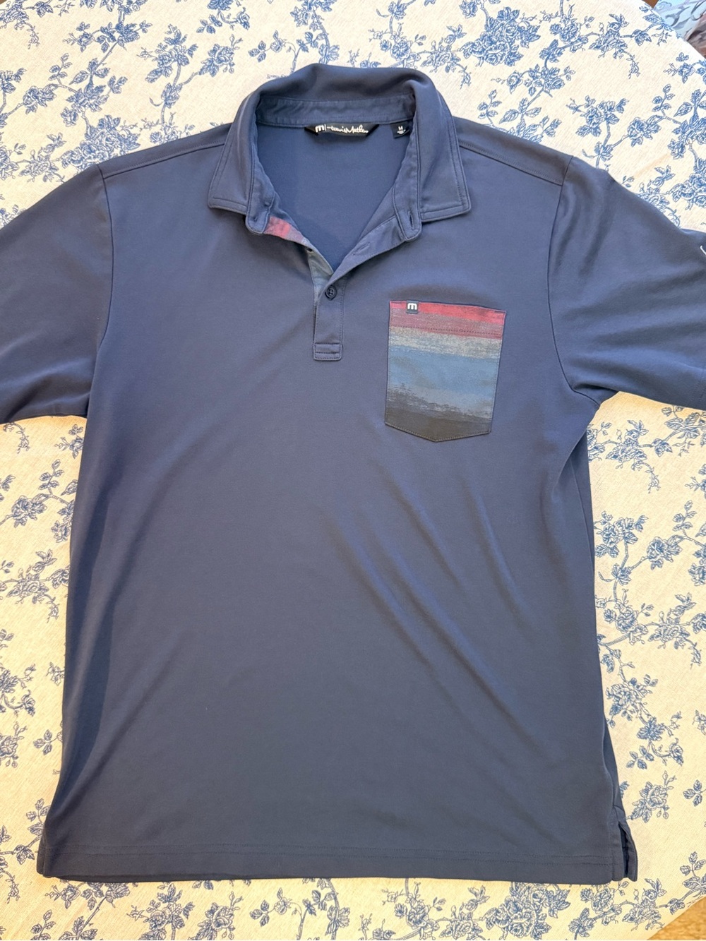 Travis Mathew Navy Polo with Striped Multicolor Pocket